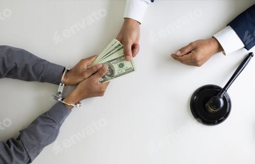 Preview: Criminals wearing handcuffs and bribery concept.