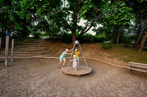 Preview: Three kids rides on the playground. Centrifuge, swing for children.