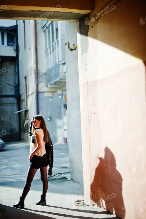 Preview: Stylish brunette girl wear on leather jacket