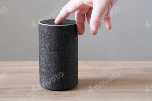 Preview: hand turning off microphone on smart speaker for privacy concerns