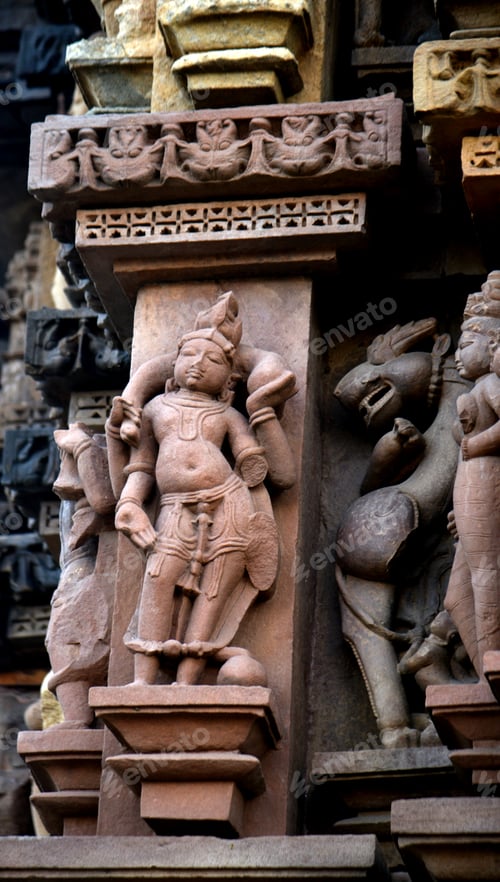 Preview: Stone carving bas relief sculptures on Khajuraho Temple, India.
