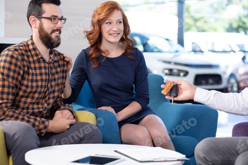 Preview: Smiling and happy marriage buying a new car in exclusive showroo
