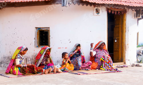 Preview: Tribal woman working her traditional handicrafts by embroidering colorful thread., india