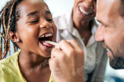 Preview: Young male pediatrician doctor examining child at office. Healthcare prevention exam people concept