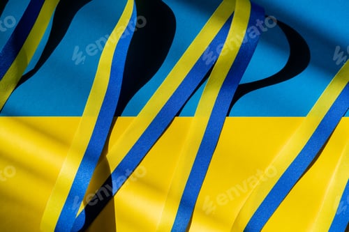 Preview: Top view of blue and yellow ribbon with shadow on ukrainian flag