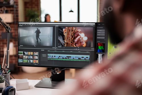 Preview: Male videographer editing video montage