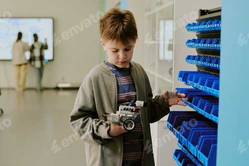 Preview: School Boy Looking at Robot