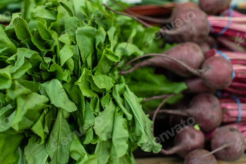 Preview: Healthy vegetables in close-up. Close-up of fresh small beetroot and bright green kind of greens