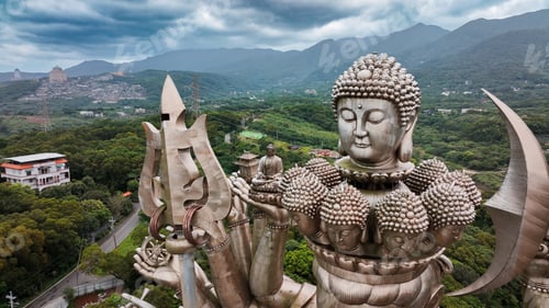 Preview: Majestic Holy Thousand Hand Guanyin statue overlooking lush mountains in Taiwan
