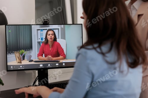 Preview: Coworkers talking on videocall, using corporate videoconference software