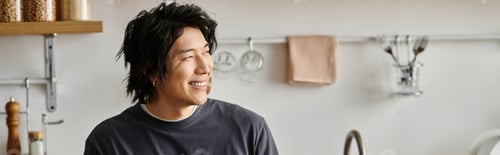 Preview: Home moment of a handsome young asian man enjoying his modern apartment lifestyle