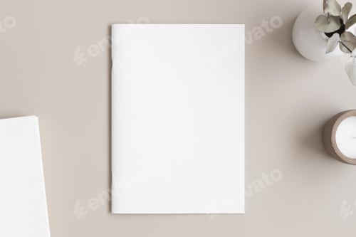 Vista previa: Magazine mockup with a book, candle and a eucalyptus on the beige table.