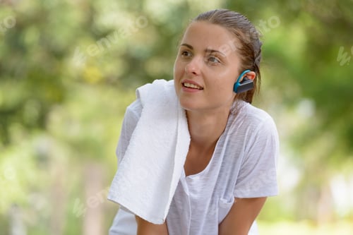 Preview: Young beautiful woman exercising at the park outdoors