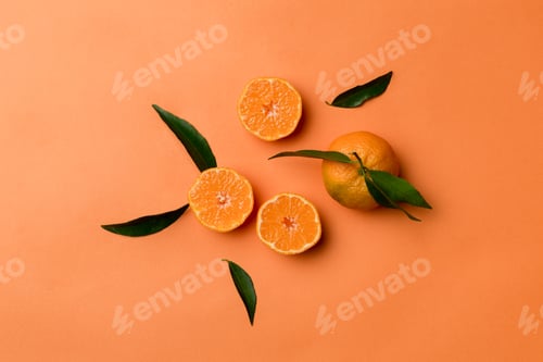 Preview: Many fresh ripe mandarin with green leaves on colored background, top view, space for text