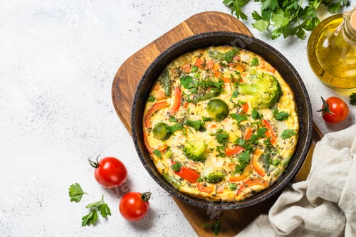 Preview: Frittata with vegetables on white stone table