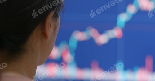 Preview: Woman watching the stock market graph