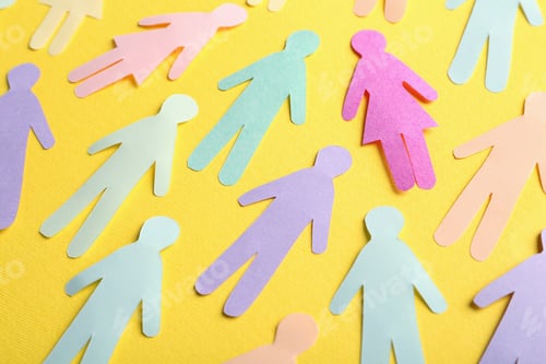 Preview: Many different paper human figures on yellow background. Diversity and inclusion concept