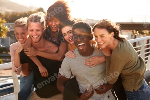 Preview: Smiling Young Friends Walking Outdoors Together
