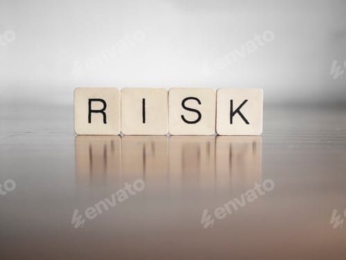 Preview: Close up of the word RISK composed with scrabble letters
