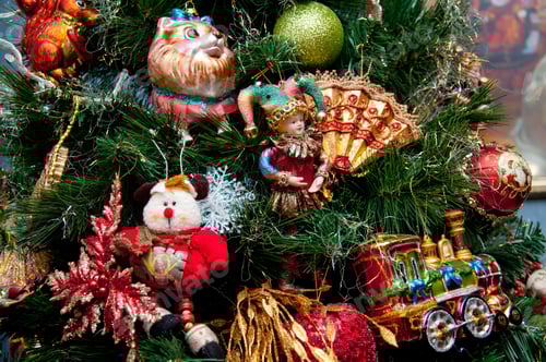 Preview: Vintage Christmas tree decorated with various ornaments. toys and baubles