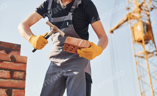 Preview: Construction worker in uniform and safety equipment have job on building