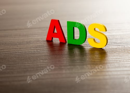 Preview: word ADS on wooden table, business concept.