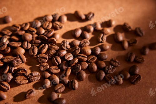 Preview: Close-Up of Roasted Coffee Beans on a Brown Surface