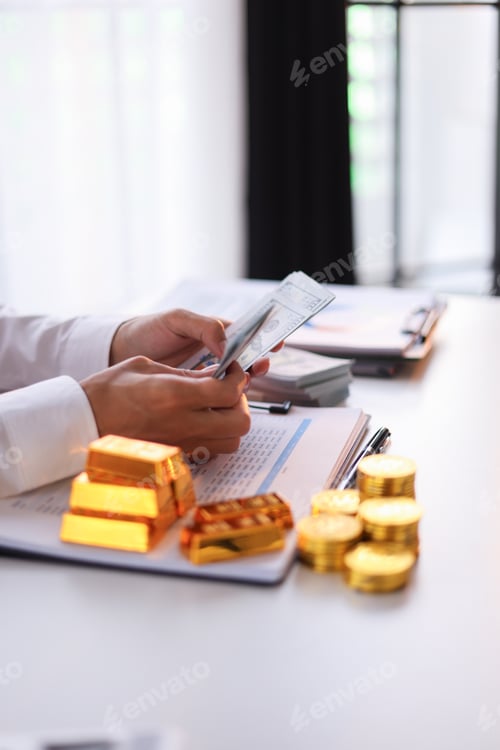 Preview: Businessman investing in gold to save against inflation and currency depreciation.