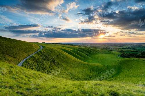 Preview: Dramatic sunset sky over The Manger at Uffington