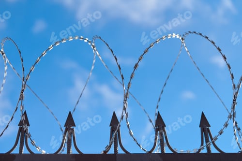 Preview: Barbed wire on fence, steel grating fence with barbs