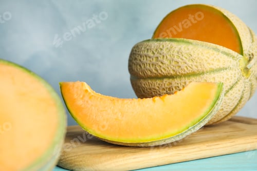 Preview: Tasty fresh melon on wooden board, closeup