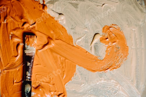 Preview: Brushstroke of Orange Paint with Brush on Canvas