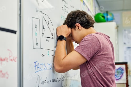 Preview: Stressed teenager student leaning on whiteboard