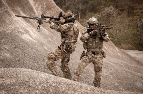 Preview: Soldiers aiming with their rifles
ready to fire during military operation