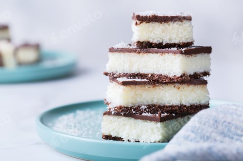 Preview: Organic raw vegan coconut bars with chocolate on kitchen table