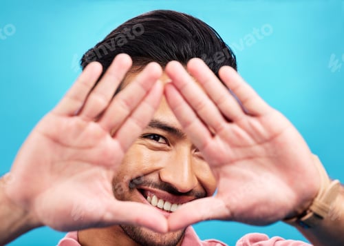 Preview: Frame, hands and portrait of happy Asian man on blue background with smile, confidence and happines