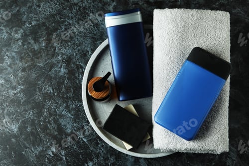 Preview: Concept of men's hygiene tools on black smokey table