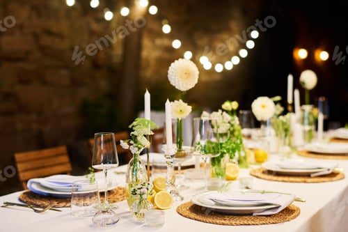 Preview: Festive table with two rows of plates with napkins prepared for wedding feast