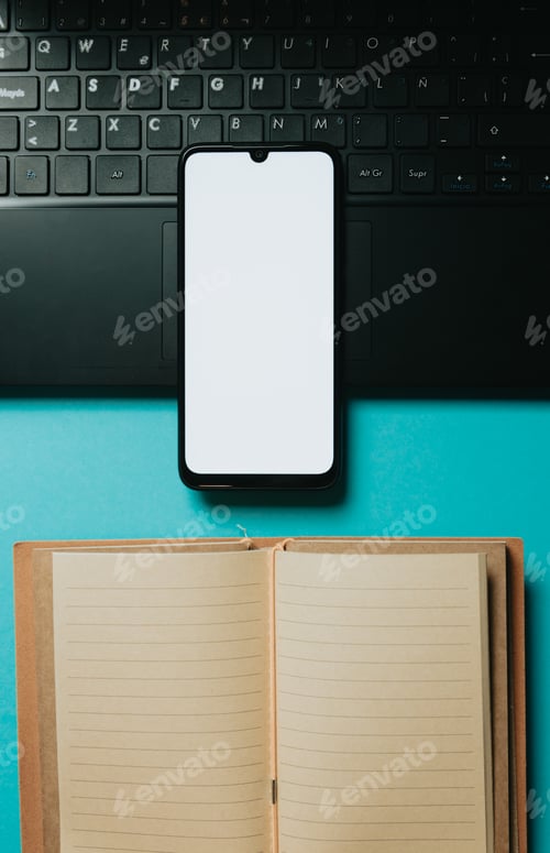 Preview: Flat lay design of a working space over blue pastel background. Mobile phone with blank