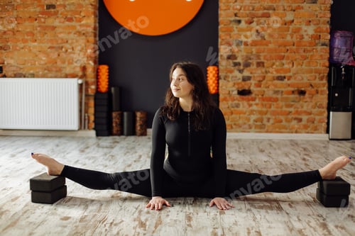 Preview: Young woman practicing yoga and fly yoga concept