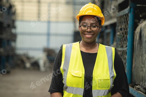 Preview: Portrait Black smart African women worker standing happy smiling in factory industry workplace
