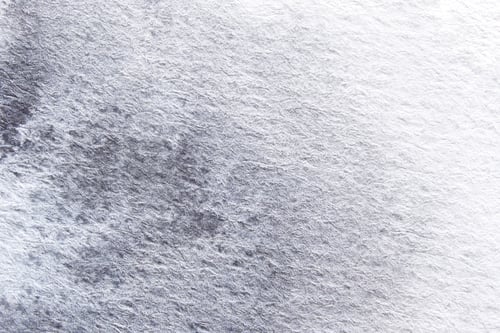 Preview: Close-up of textured grey paper surface with subtle variations and abstract