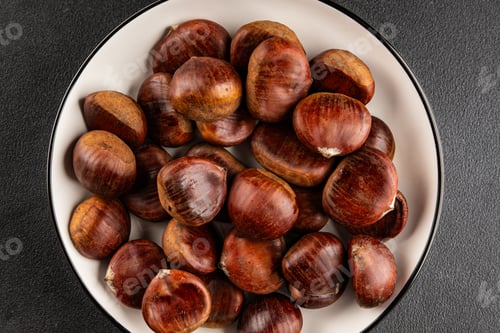 Preview: Edible chestnuts delicious treat tasty snack fresh gourmet food background on table rustic food