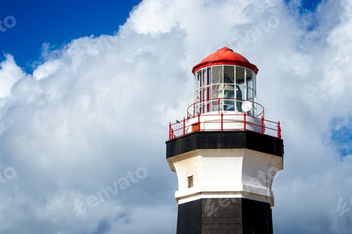 Preview: Low angle shot of a lighthouse under the beautiful cloud in the sky