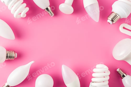 Preview: top view of various light bulbs on pink background, energy concept