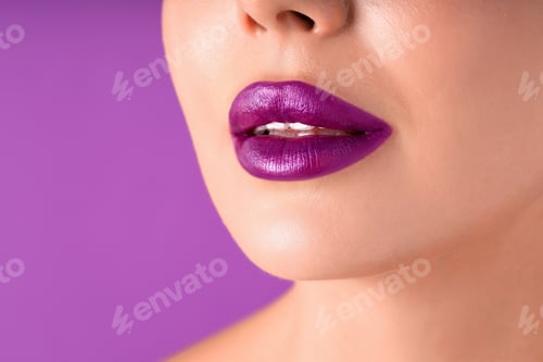 Preview: Woman with bright lipstick on purple background, macro view
