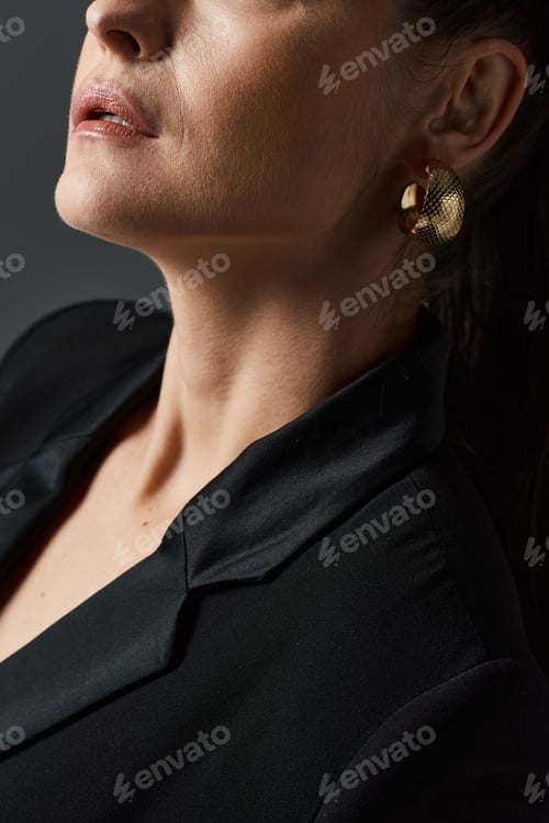 Preview: Elegant Woman in Black Shirt and Gold Earrings