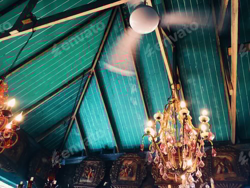 Preview: Beautiful vintage chandelier and fan on colourful turquoise background