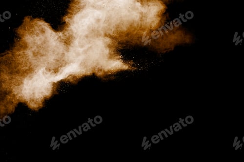 Preview: Brown particles splattered on black background. Brown dust splashing.