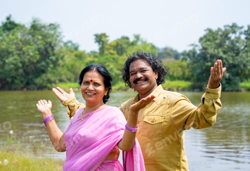 Preview: Happy Indian couple in front of river